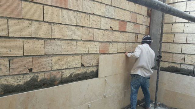 Methods of installing stone facades